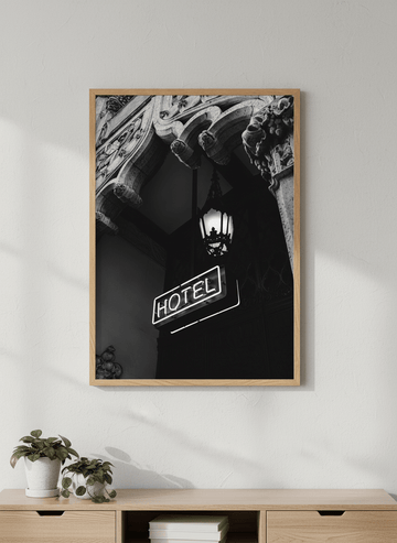 Modern wall art styled above a sofa in a neutral living room