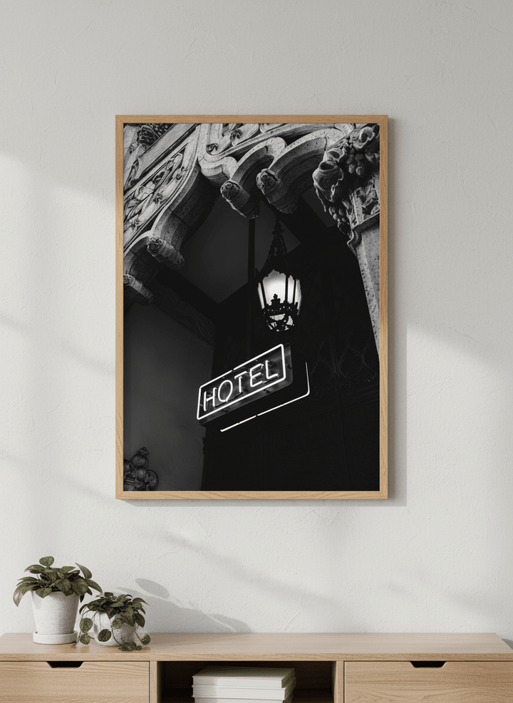 Modern wall art styled above a sofa in a neutral living room