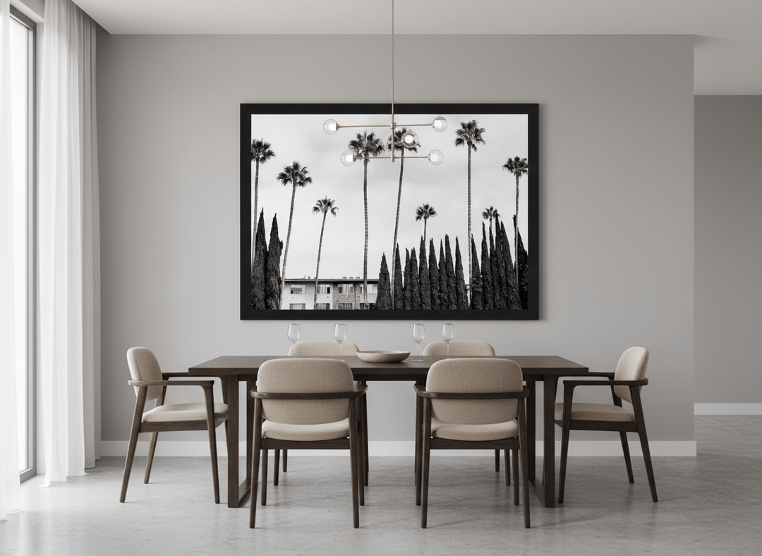 Wall art styled above a dining table in a contemporary home