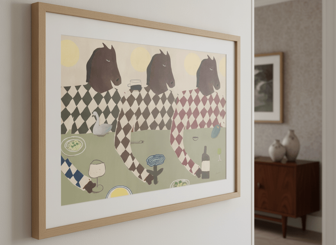 Wall art styled above a dining table in a contemporary home
