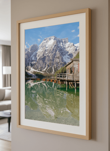 Modern wall art styled above a sofa in a neutral living room