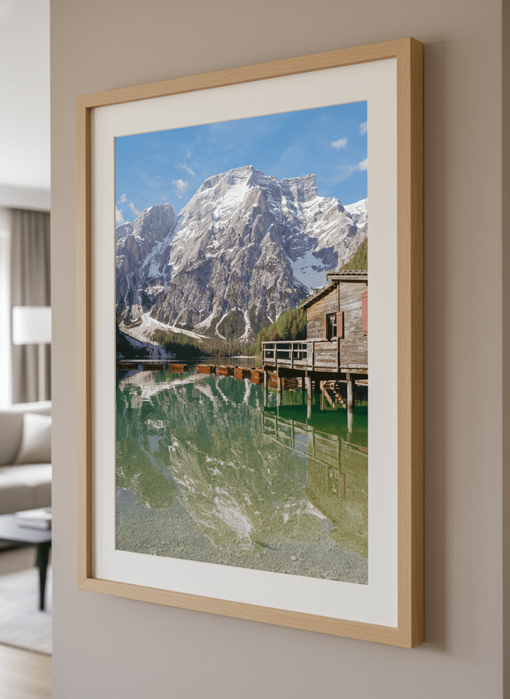 Modern wall art styled above a sofa in a neutral living room