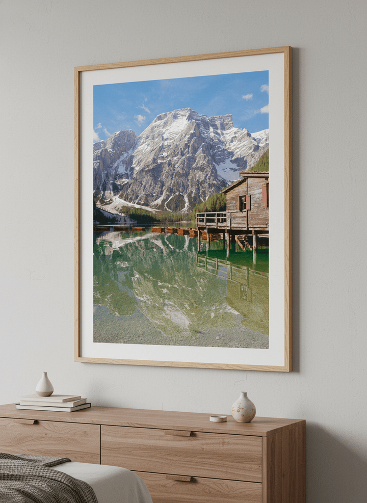 Minimalist artwork displayed in a calm, light-filled bedroom interior