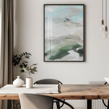 Abstract art piece on a wall above a wooden table with decor items.