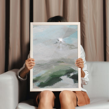 Person holding abstract painting in front of their face against a neutral background