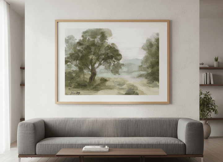 Modern wall art styled above a sofa in a neutral living room