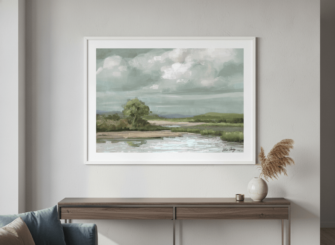 Modern wall art styled above a sofa in a neutral living room
