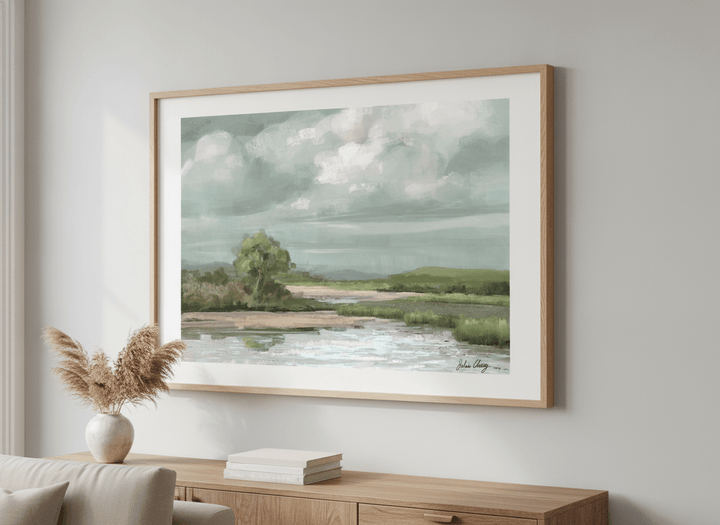 Modern wall art styled above a sofa in a neutral living room