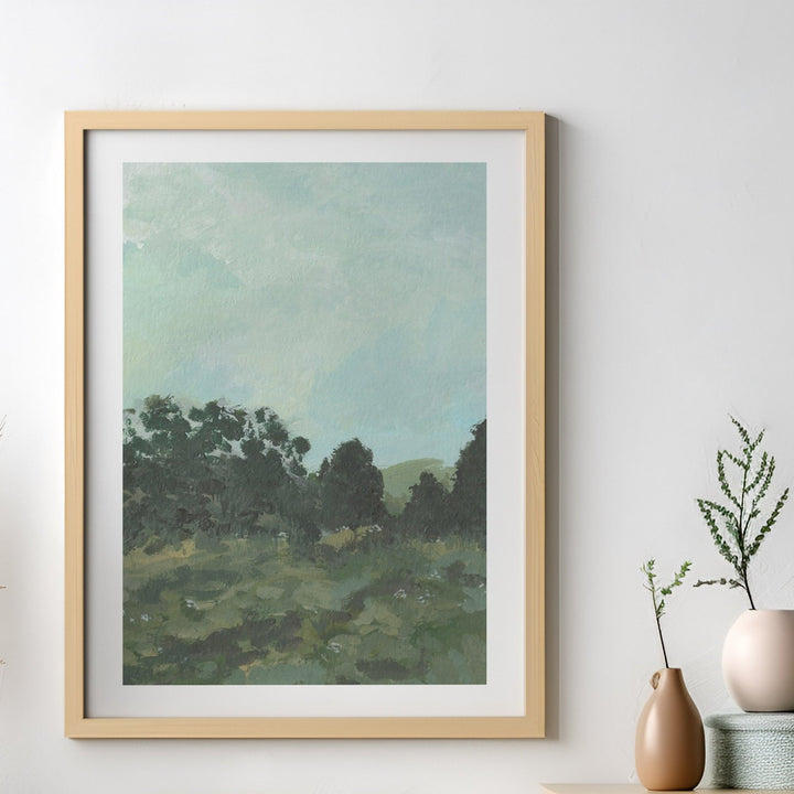 Artwork of a landscape with trees and a sky, displayed on a wall with decorative vases.