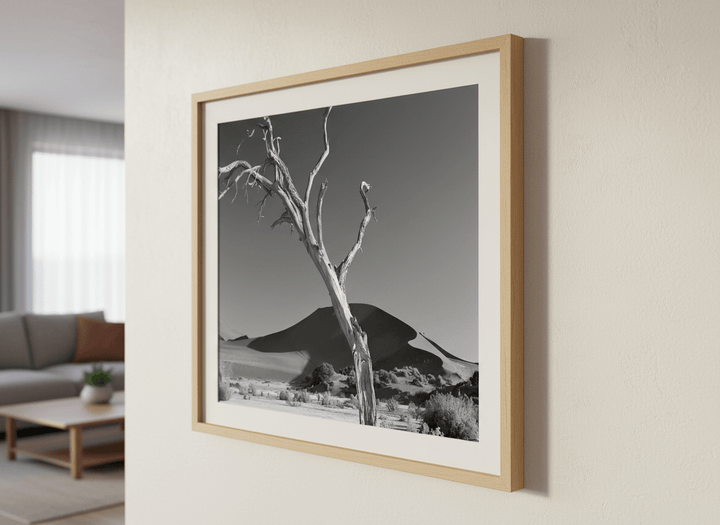 Modern wall art styled above a sofa in a neutral living room