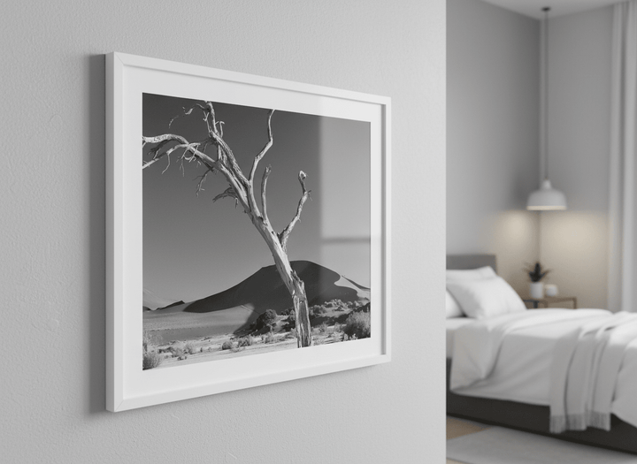 Minimalist artwork displayed in a calm, light-filled bedroom interior