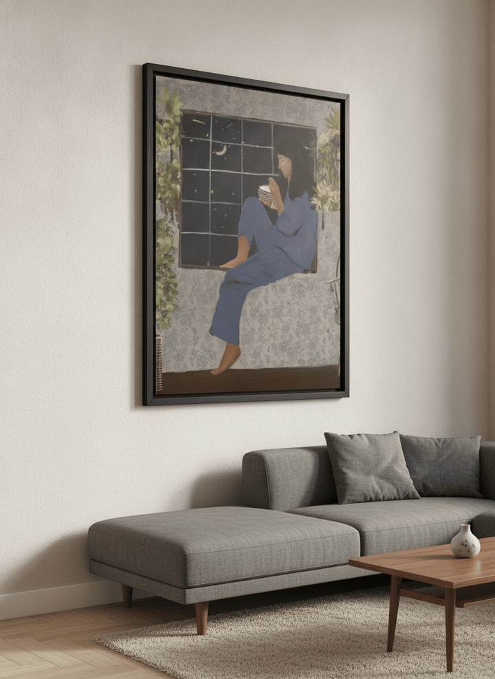 Modern wall art styled above a sofa in a neutral living room