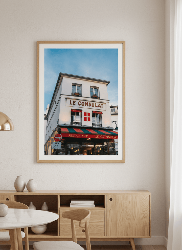 Wall art styled above a dining table in a contemporary home