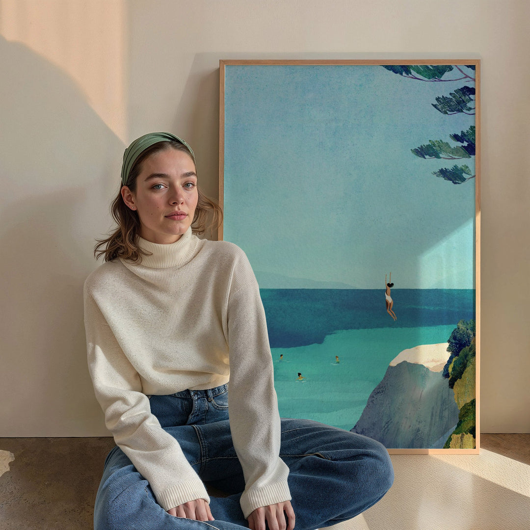 Woman sitting in front of a painting of a beach scene