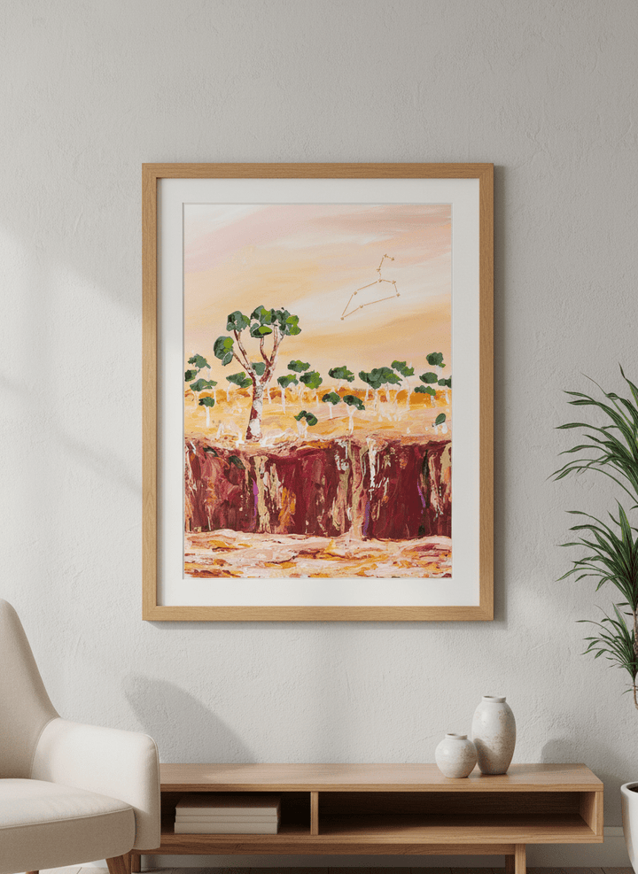 Modern wall art styled above a sofa in a neutral living room