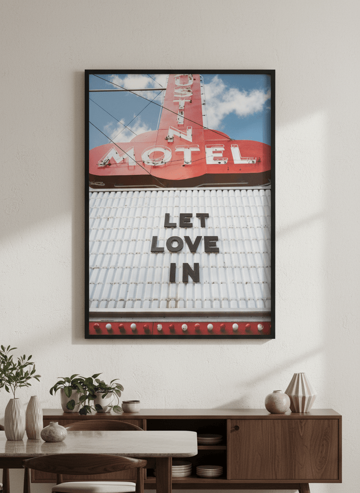 Wall art styled above a dining table in a contemporary home