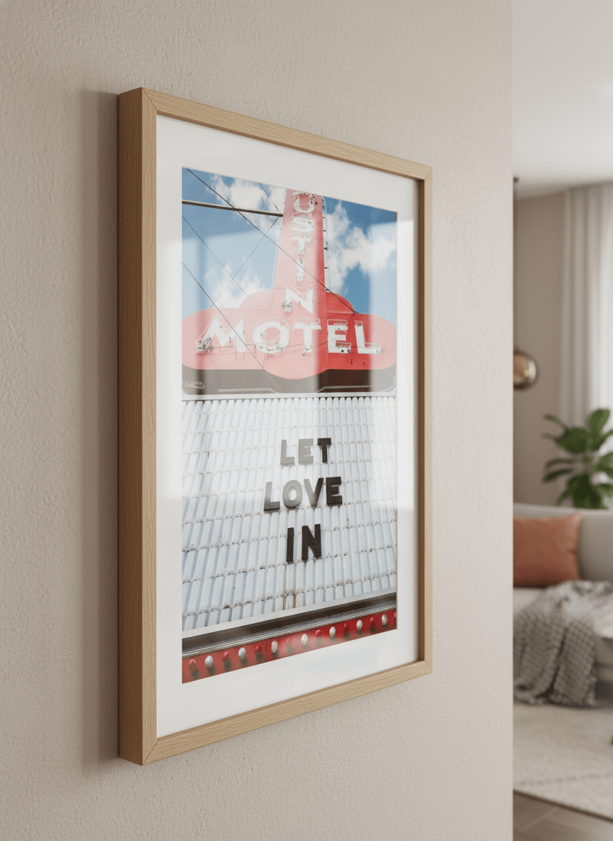 Modern wall art styled above a sofa in a neutral living room