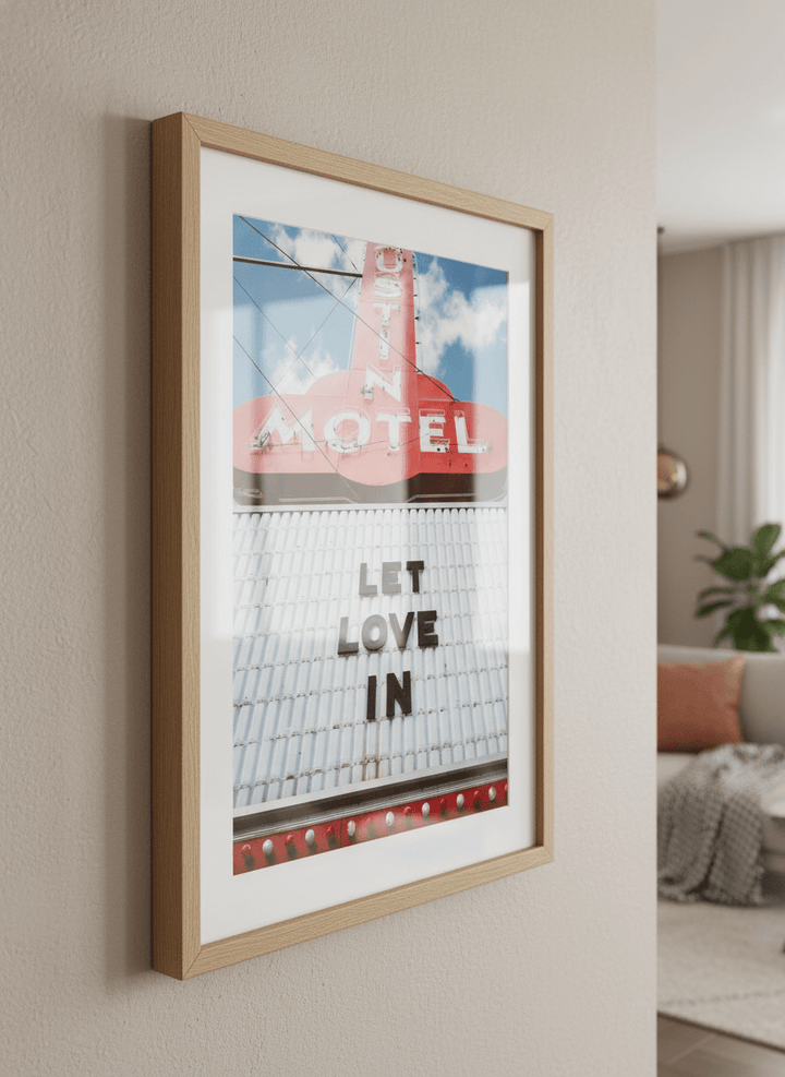 Modern wall art styled above a sofa in a neutral living room