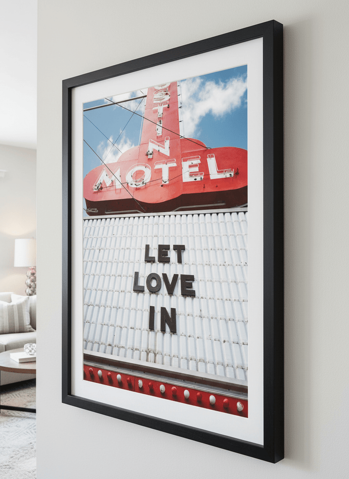 Modern wall art styled above a sofa in a neutral living room