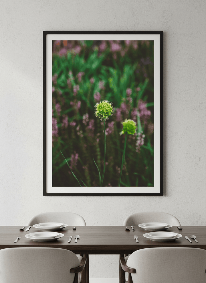 Wall art styled above a dining table in a contemporary home
