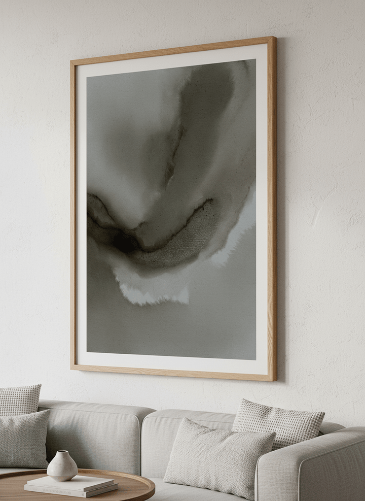 Modern wall art styled above a sofa in a neutral living room