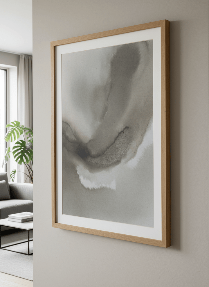 Modern wall art styled above a sofa in a neutral living room