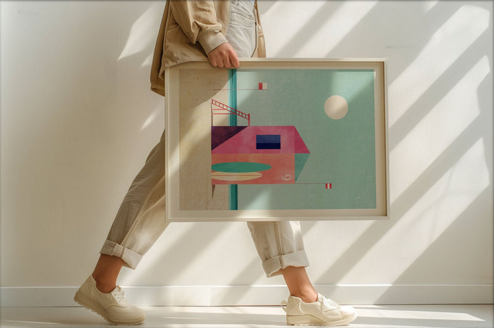 Person holding an abstract art piece in a bright room with sunlight casting shadows.