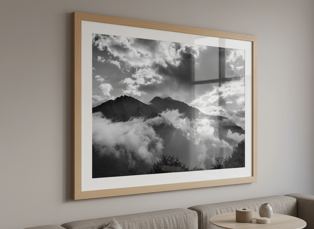 Modern wall art styled above a sofa in a neutral living room