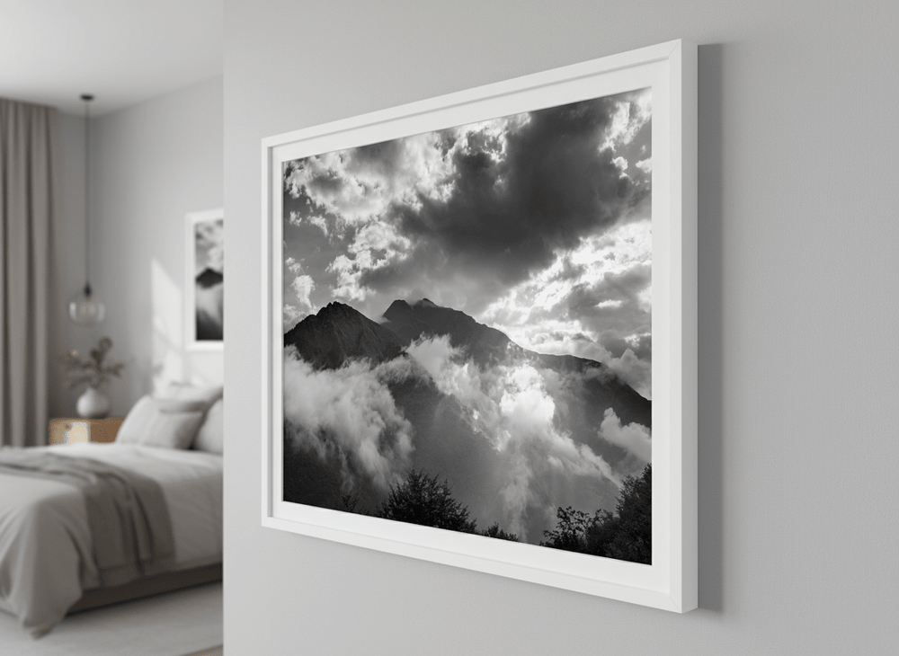 Minimalist artwork displayed in a calm, light-filled bedroom interior