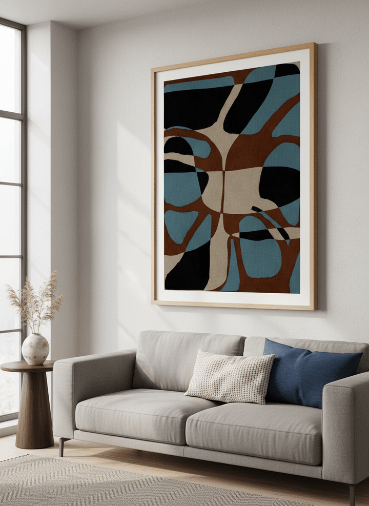 Modern wall art styled above a sofa in a neutral living room