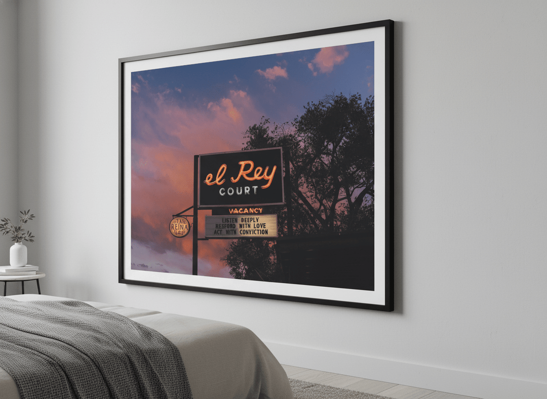 Minimalist artwork displayed in a calm, light-filled bedroom interior
