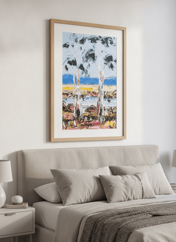 Minimalist artwork displayed in a calm, light-filled bedroom interior