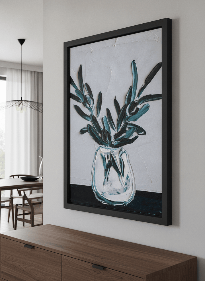 Wall art styled above a dining table in a contemporary home