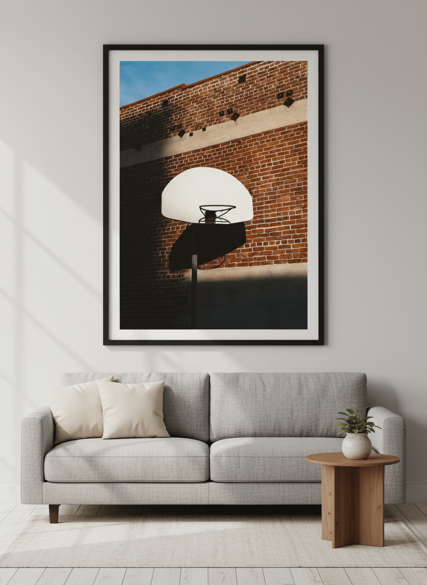 Modern wall art styled above a sofa in a neutral living room