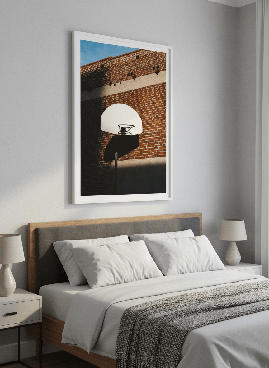 Minimalist artwork displayed in a calm, light-filled bedroom interior