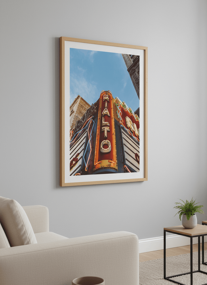 Modern wall art styled above a sofa in a neutral living room