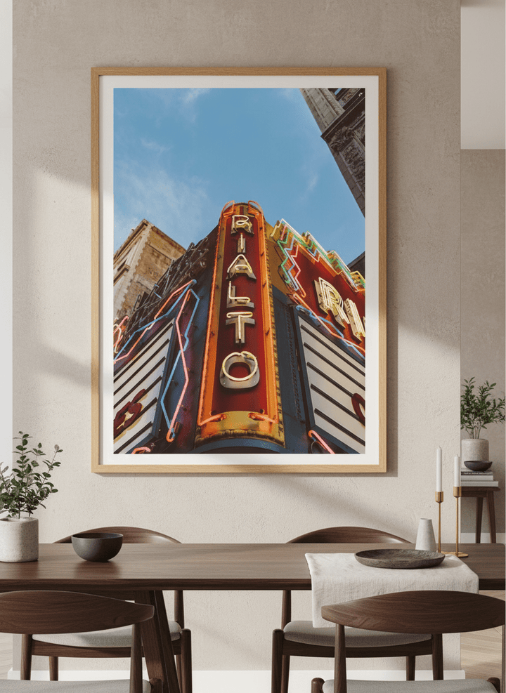 Wall art styled above a dining table in a contemporary home