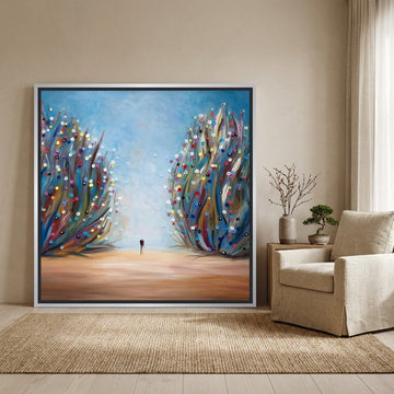 Oversized statement canvas wall art with a silver leaf surround leaning against the wall in a warm Japandi bedroom