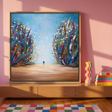 Canvas wall art with a natural timber surround standing on a sideboard in a colourful eclectic bedroom