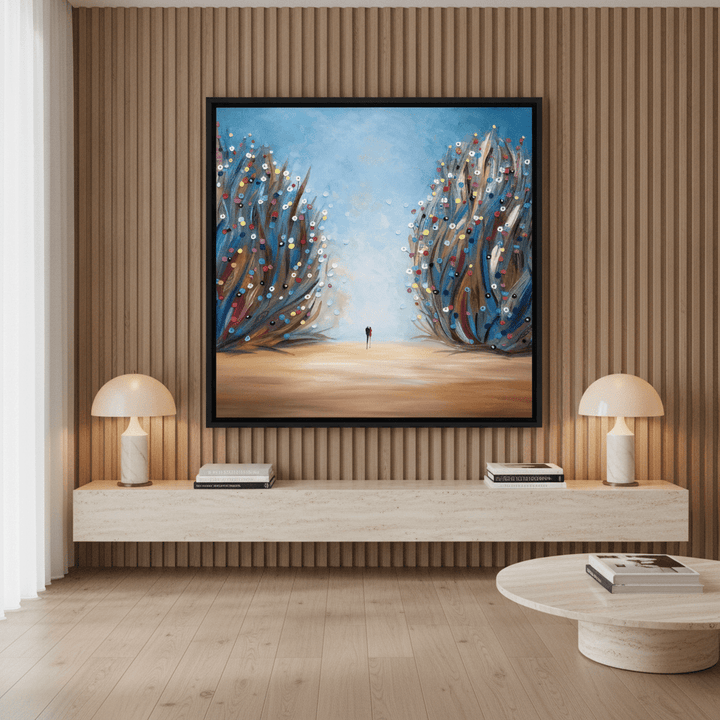 Oversized statement canvas wall art with a black surround styled on the wall in a luxe living room