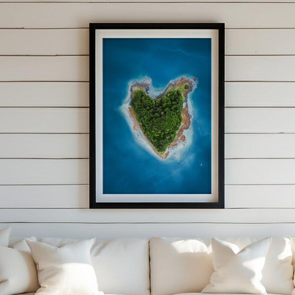 White sectional sofa in a room with a picture of an island on the wall.