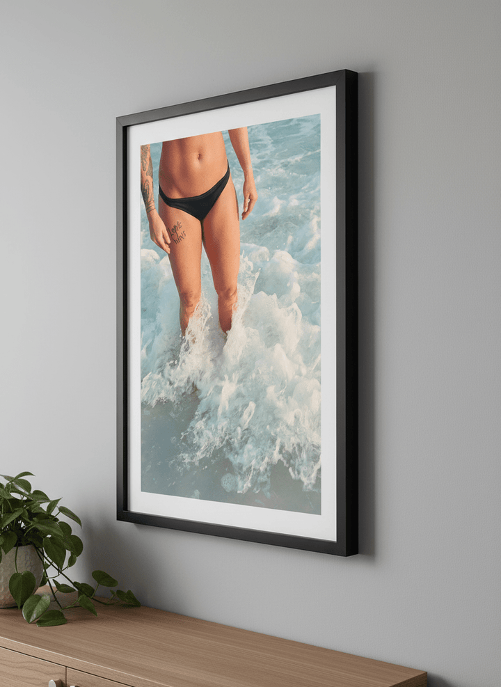 Modern wall art styled above a sofa in a neutral living room