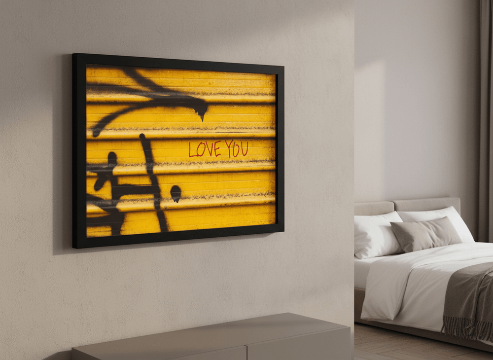 Minimalist artwork displayed in a calm, light-filled bedroom interior