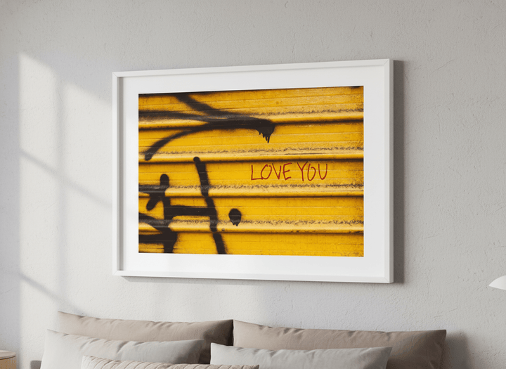 Minimalist artwork displayed in a calm, light-filled bedroom interior