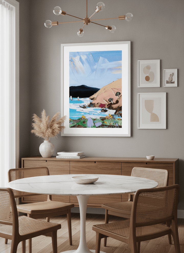 Wall art styled above a dining table in a contemporary home