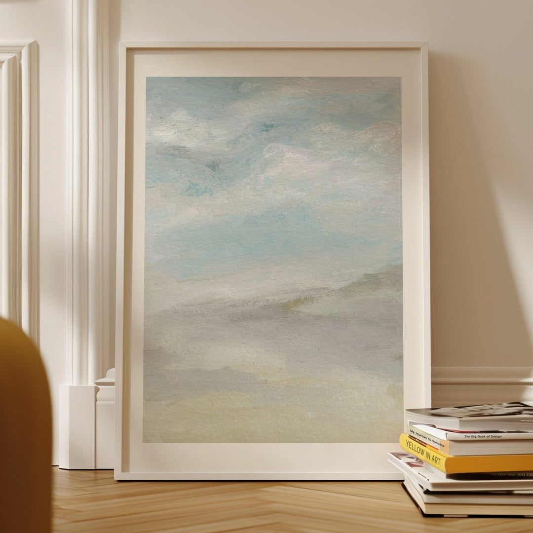 Artwork on a wall with books below