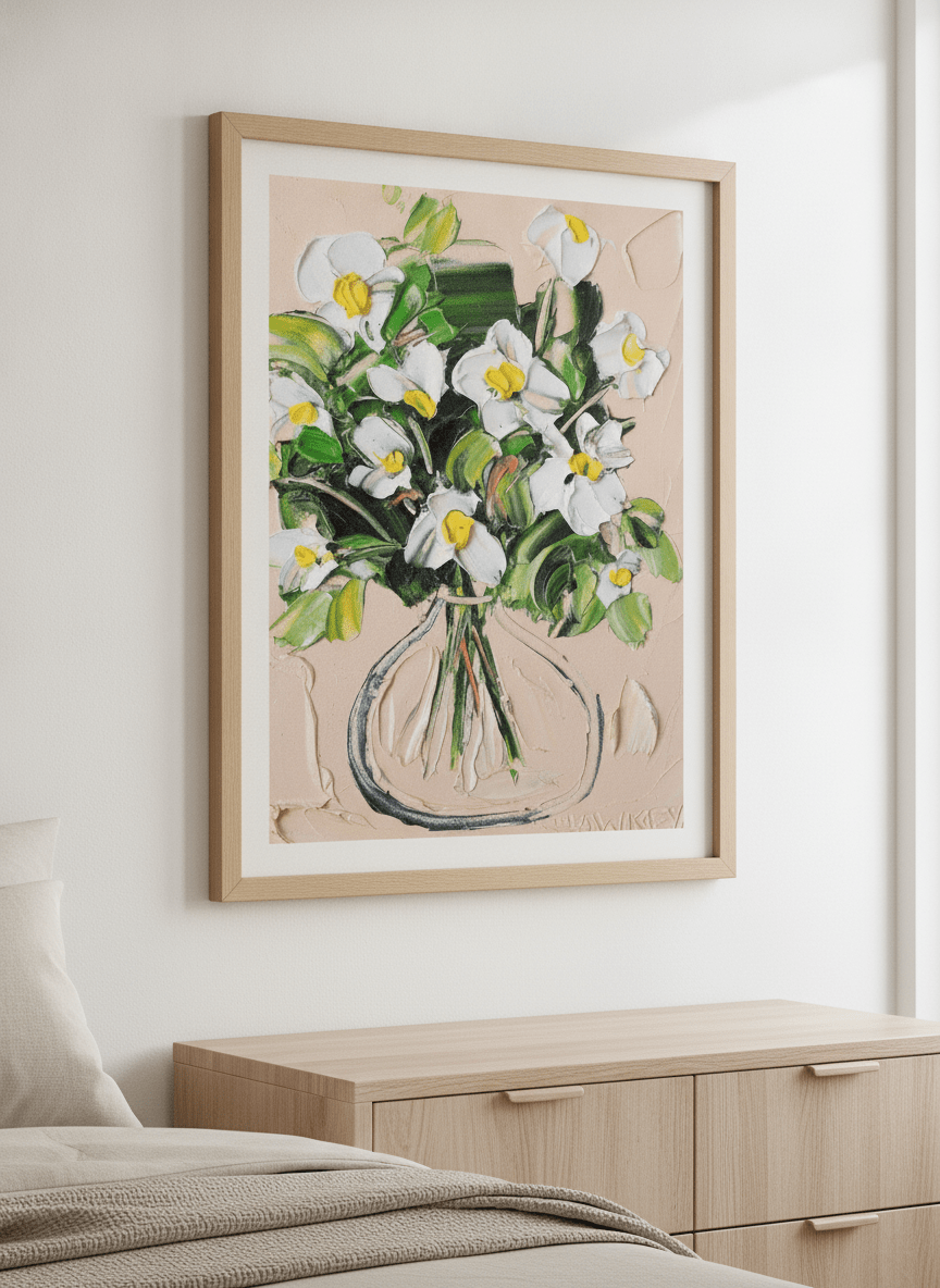 Minimalist artwork displayed in a calm, light-filled bedroom interior