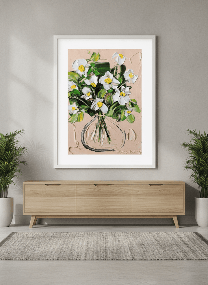 Wall art styled above a dining table in a contemporary home