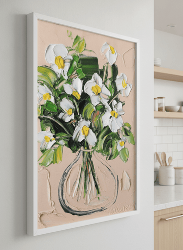 Artwork styled on the wall of a bright modern kitchen