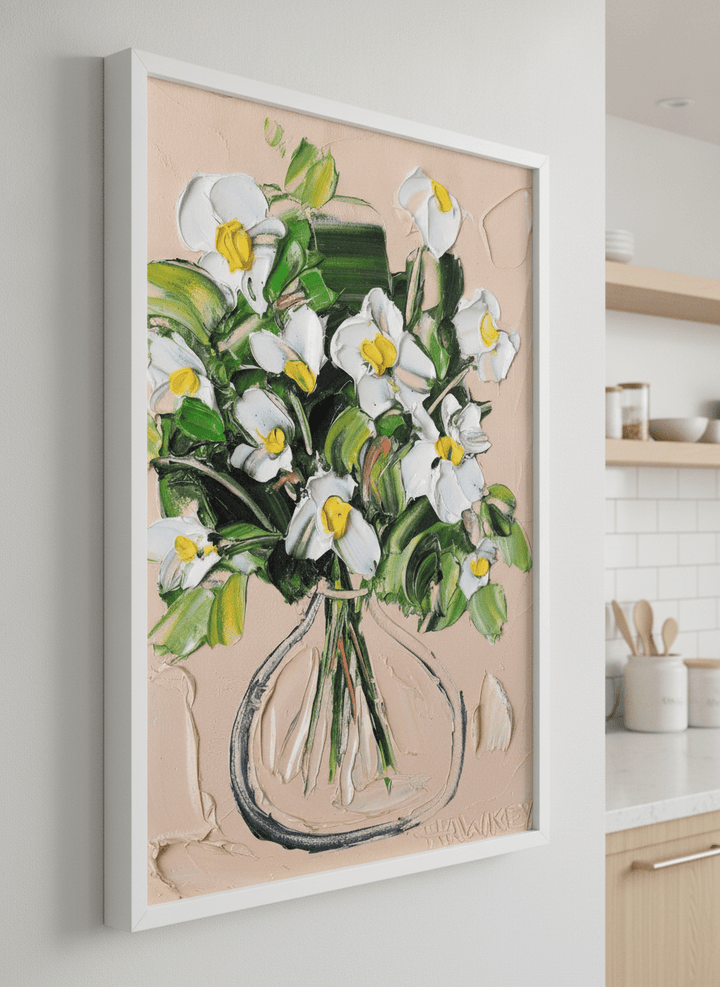 Artwork styled on the wall of a bright modern kitchen